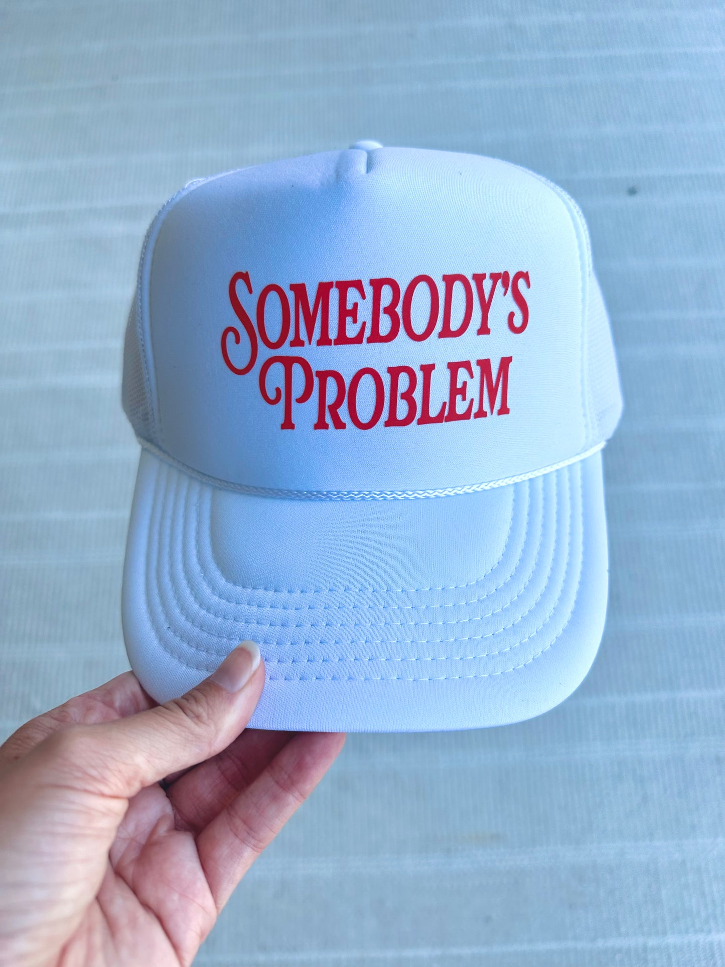 somebody’s problem trucker hat